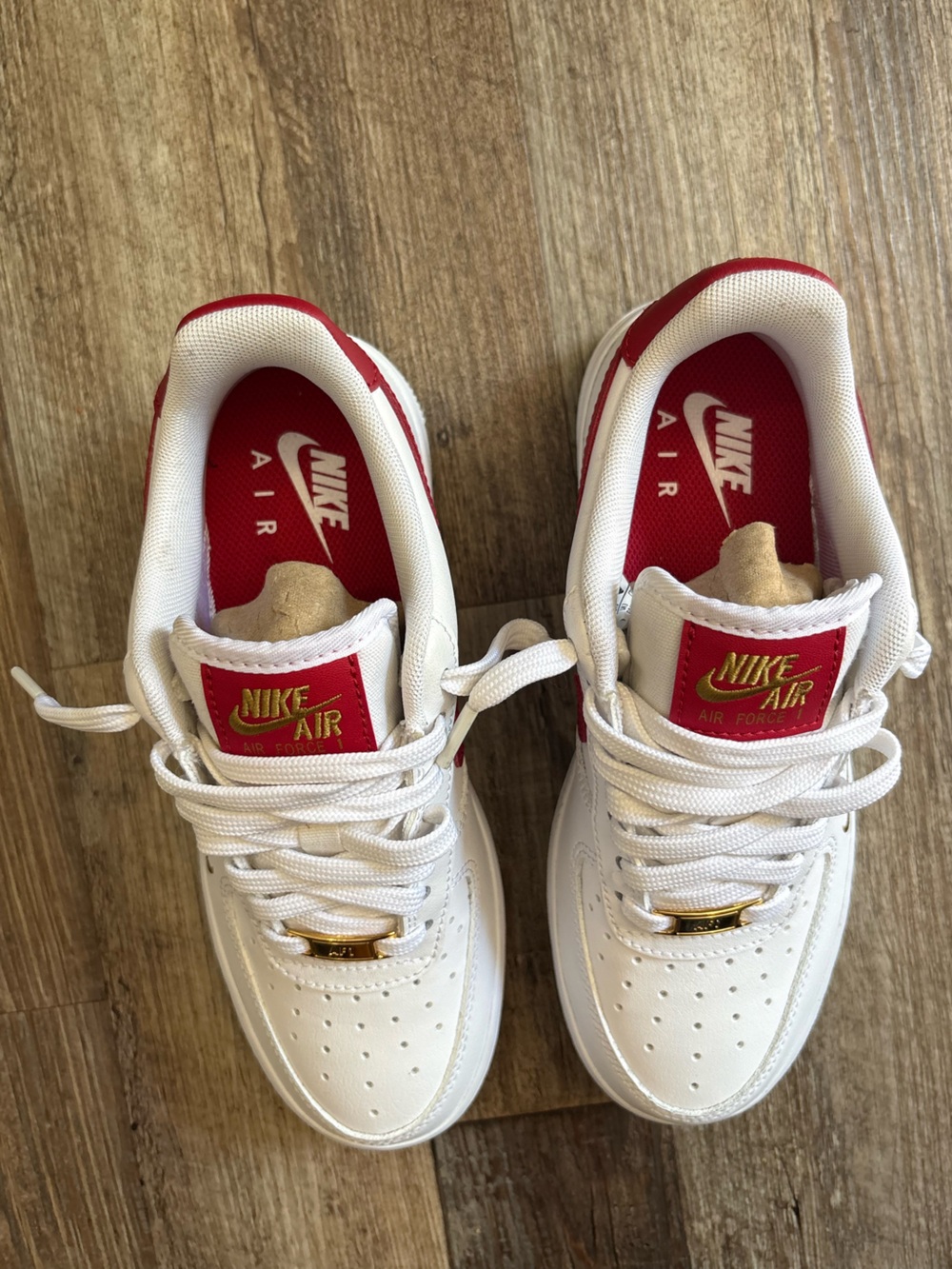 Nike women’s White Air Force’s with Red and Gold Accents